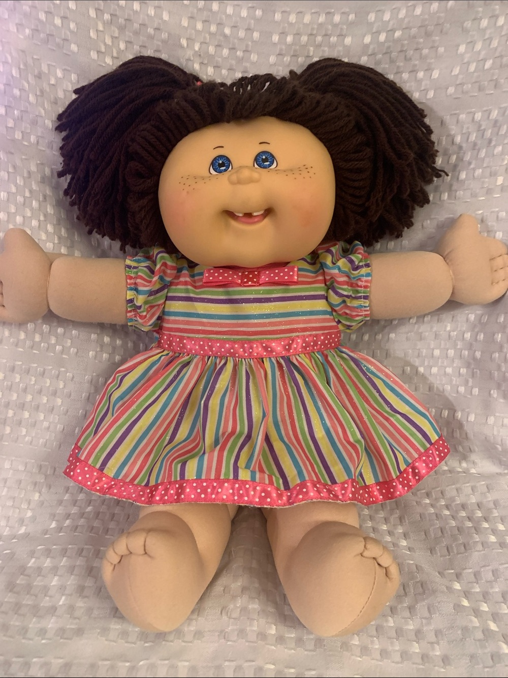 Cabbage Patch Play Along doll from 2004. Brown pigtails and blue eyes.